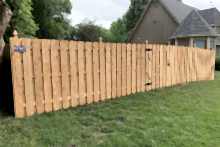 6' tall cedar shadow box fence with French Gothic posts